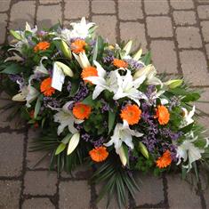 White and Orange Casket Spray